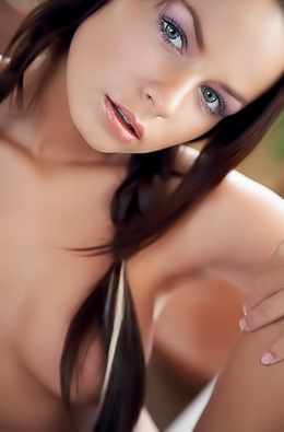 Brunette pleases her pussy on table