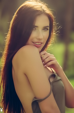 Redheaded hottie Niemira has naked fun in the forest