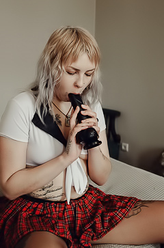 Sem Retlick Grabs Her Ass Enticingly In A Plaid Skirt And Black Pantyhose