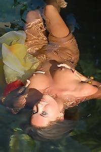 Naked Blonde With Long Hair In The Water