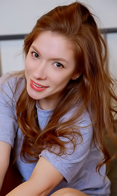 Sata Jones Voluptuous Beauty Smiles Seductively As She Spreads Her Long Legs In A Wide Split